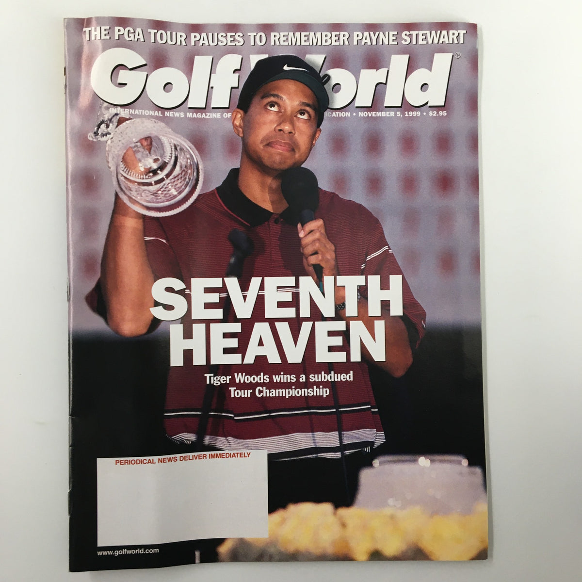Cover of Golf World Magazine, November 5, 1999, featuring Tiger Woods holding a trophy and celebrating his victory, with the title 'Seventh Heaven' prominently displayed.