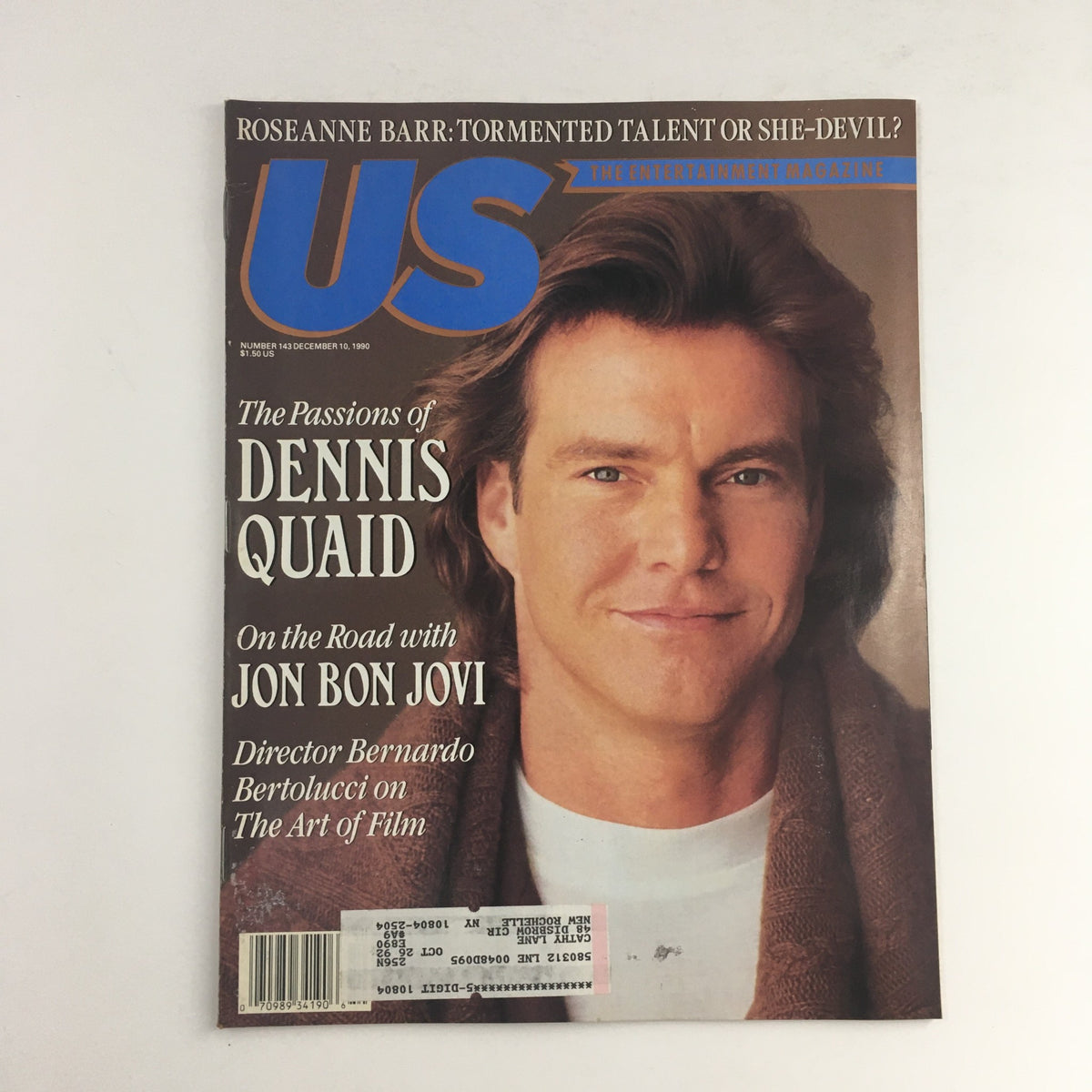 US Magazine #143 cover from December 10, 1990 featuring Dennis Quaid, with headlines about his passions, and mentions of Jon Bon Jovi and Roseanne Barr.