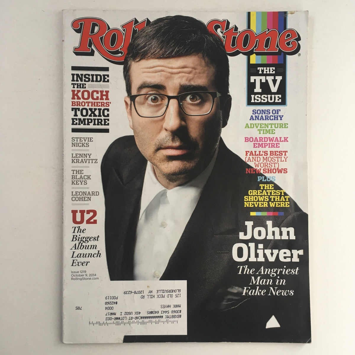 Rolling Stone Magazine cover dated October 9, 2014, featuring John Oliver, Stevie Nicks, and Lenny Kravitz. The magazine highlights cultural commentary and music insights, showcasing John Oliver as 'The Angriest Man in Fake News'.