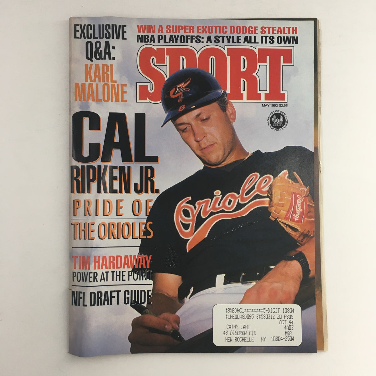 Cover of Sport Magazine May 1992 featuring Cal Ripken Jr. with the title 'Sport'. The magazine highlights prominent athletes including Karl Malone and Tim Hardaway and includes an NFL Draft Guide.