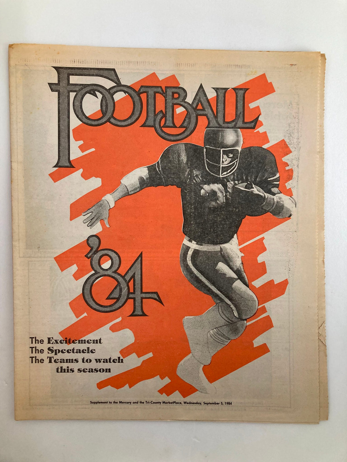 Cover of the supplement to the Mercury September 5 1984 NFL Football '84 Season showcasing a football player against an orange background.