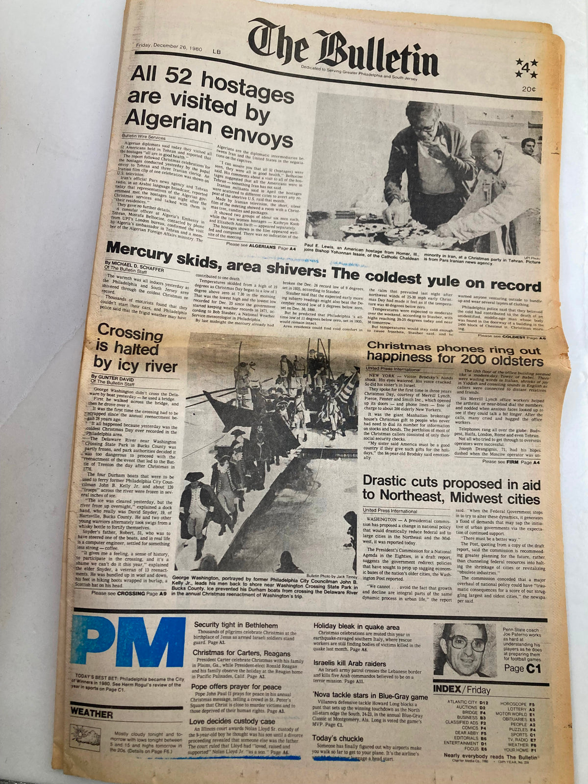 The Bulletin Newspaper dated December 26, 1980, featuring the headline 'Mercury Skids Area Shivers Coldest Yule'. The front page covers significant news including weather challenges and hostages visited by Algerian envoys.