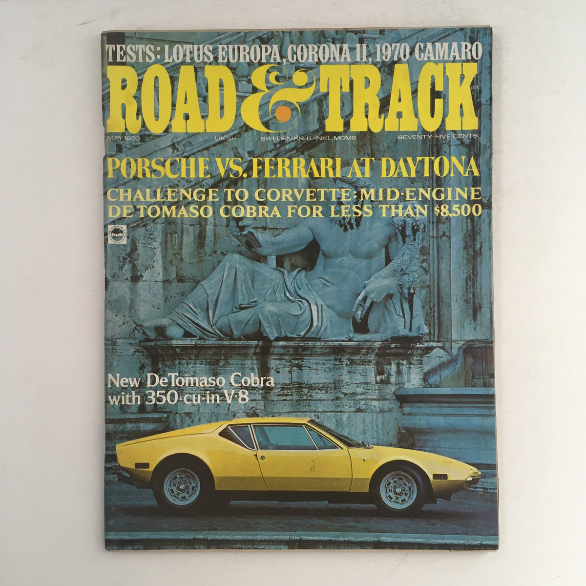 Cover of Road & Track Magazine May 1970 featuring a DeTomaso Cobra V-8 and a Lotus Europa test. The magazine highlights a comparison between Porsche and Ferrari at Daytona, and features a new DeTomaso Cobra with a 350 cubic inch V-8. An essential collectible for automotive enthusiasts.