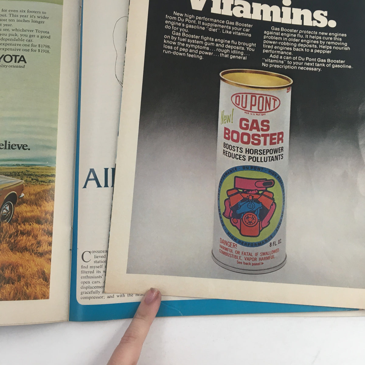 Inside page of Road & Track Magazine June 1971 displaying a Du Pont Gas Booster advertisement, highlighting vintage automotive products and technology.