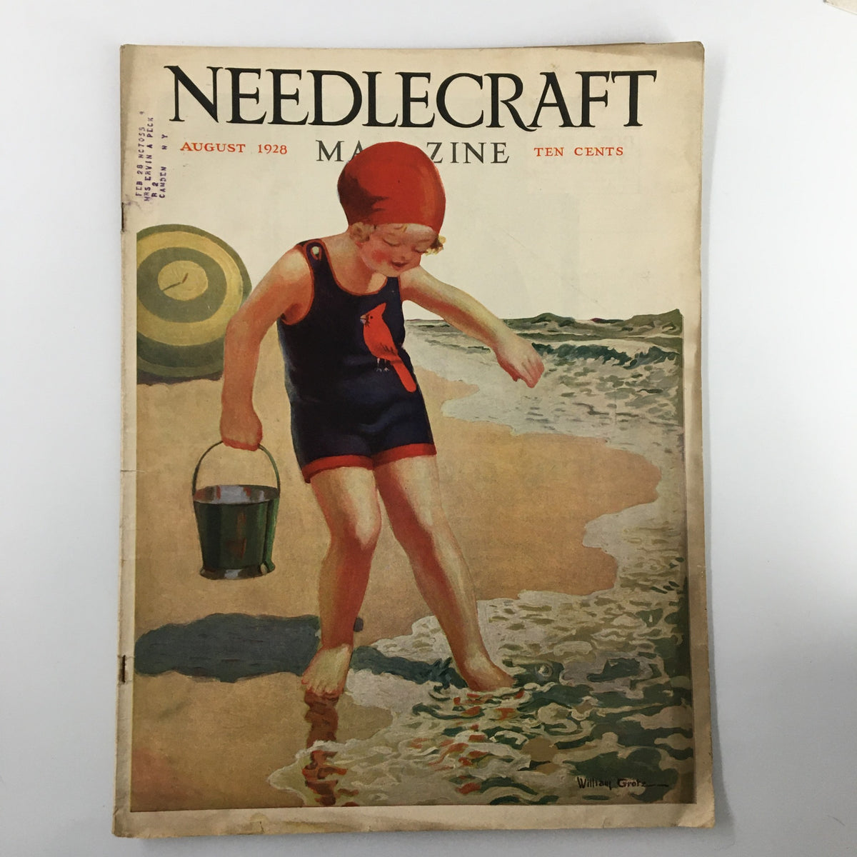 Vintage VTG Needlecraft Magazine cover from August 1928, featuring a colorful illustration of a young girl in swimwear walking by the shore, capturing the essence of 1920s design.
