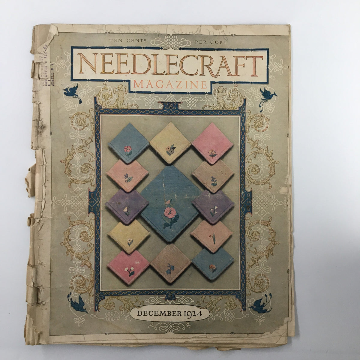 Cover of VTG Needlecraft Magazine December 1924, featuring a quilt design in pastel colors, showcasing vintage needlework and holiday crafting inspiration.