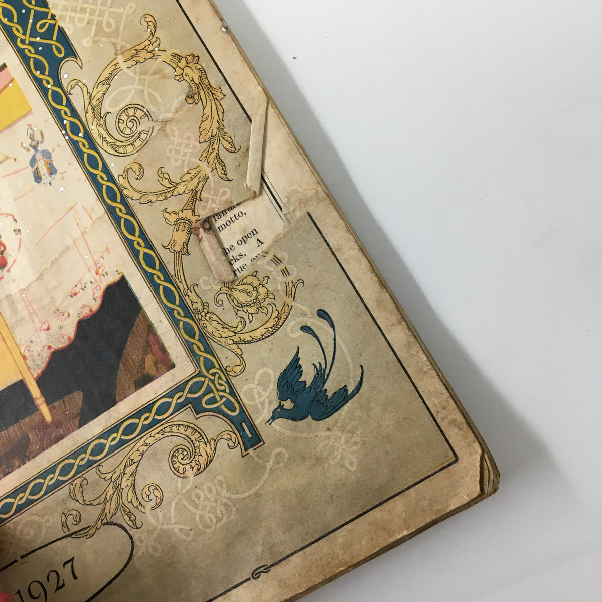 Detail view of the VTG Needlecraft Magazine March 1927 cover, highlighting decorative elements and artistic blue bird motif.