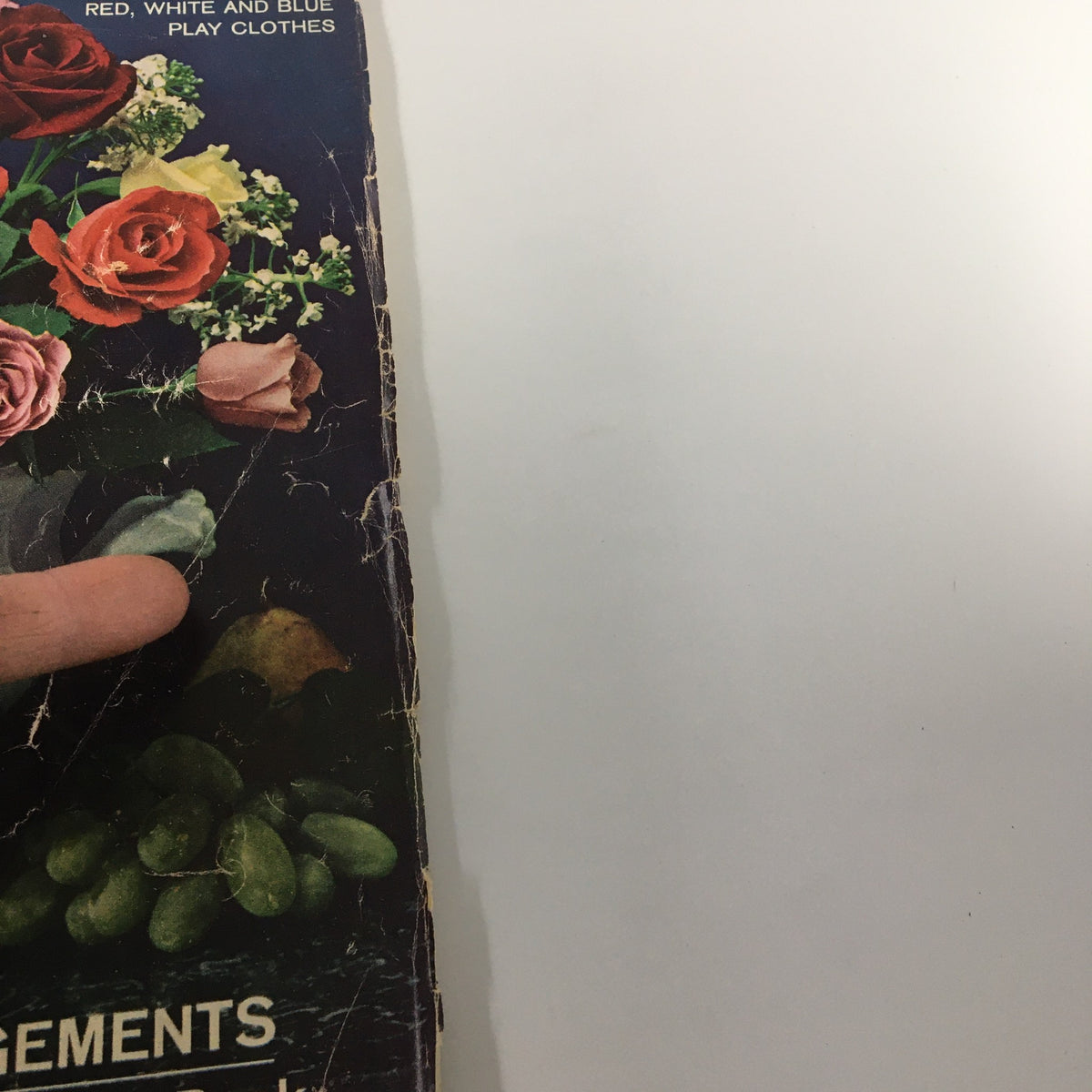 Close-up view of the VTG Woman's Day Magazine June 1963 cover, detailing summer flower arrangements and features, showcasing wear and nostalgia.