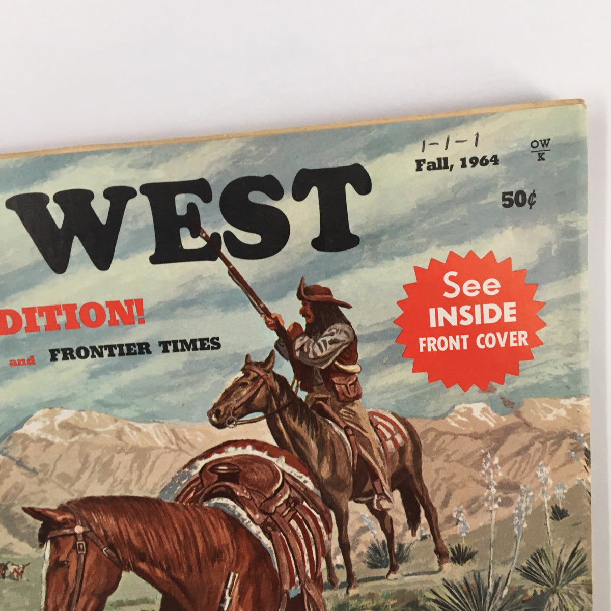 Close-up view of the cover of VTG Old West Magazine Fall 1964 showing the title and thematic details, including a cowboy aiming his rifle, emphasizing its collectible nature.