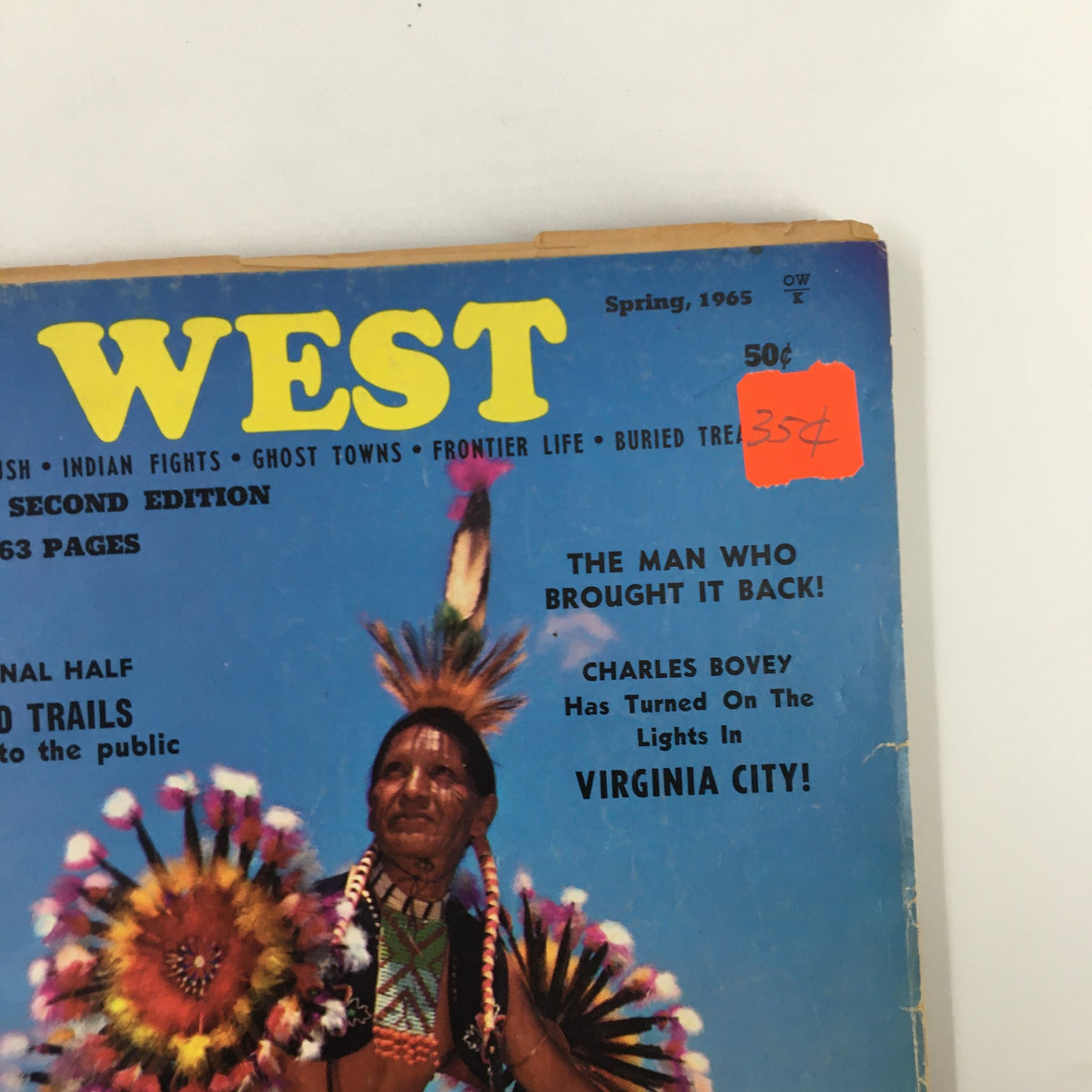 Close-up of VTG Old West Magazine Spring 1965 cover showcasing the bold title 'WEST' and price tag, along with the featured story 'The Man Who Brought It Back'.