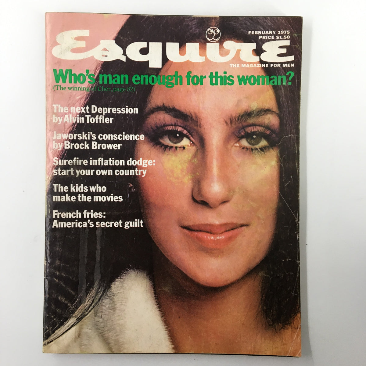 Cover of VTG Esquire Magazine February 1975 featuring the title 'Who's Man Enough For This Woman?' with an image of Cher, showcasing cultural themes from the 1970s.