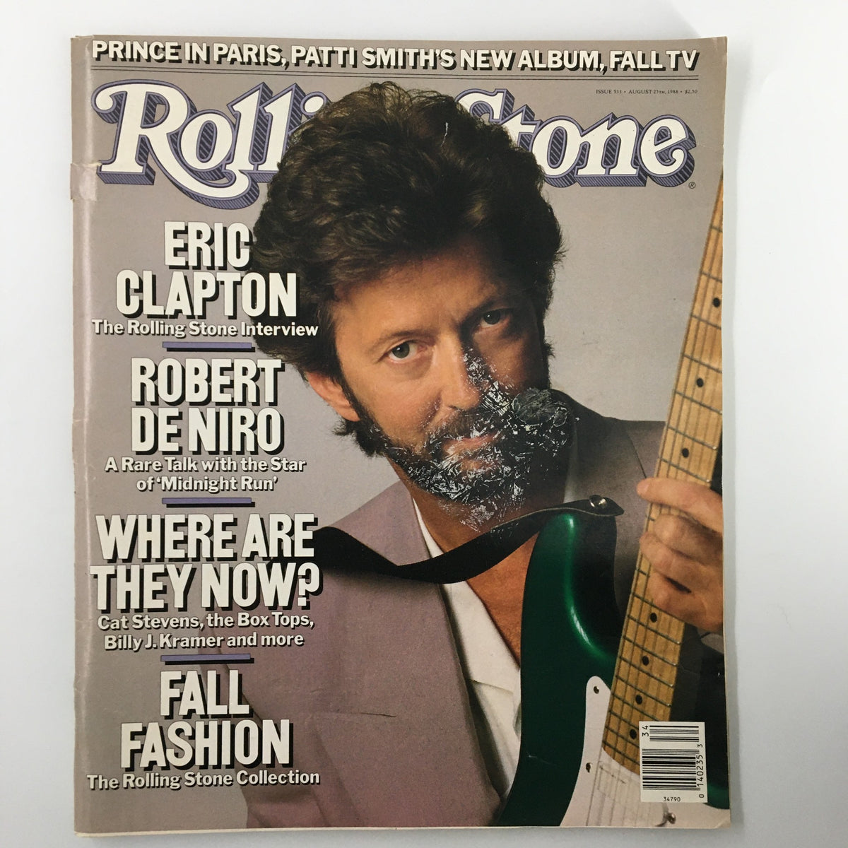 VTG Rolling Stone Magazine August 25 1988 cover featuring Eric Clapton and Robert De Niro, showcasing a vintage design with headlines about their interviews and a vibrant guitar presence.