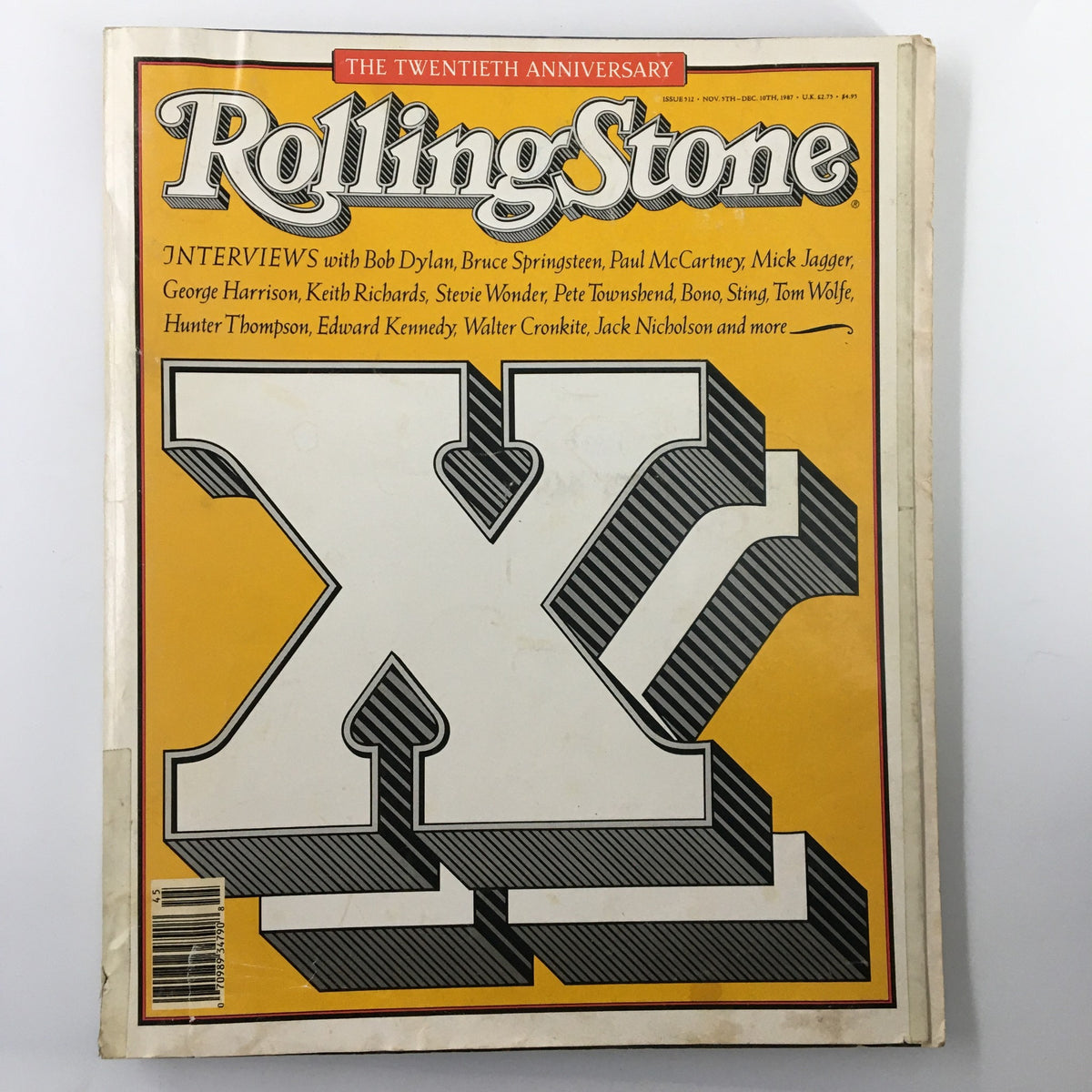 Vintage Rolling Stone magazine from November 5, 1987, featuring interviews with Bob Dylan and Bruce Springsteen on the cover. The magazine showcases a yellow and black themed design, highlighting key figures in rock music history.