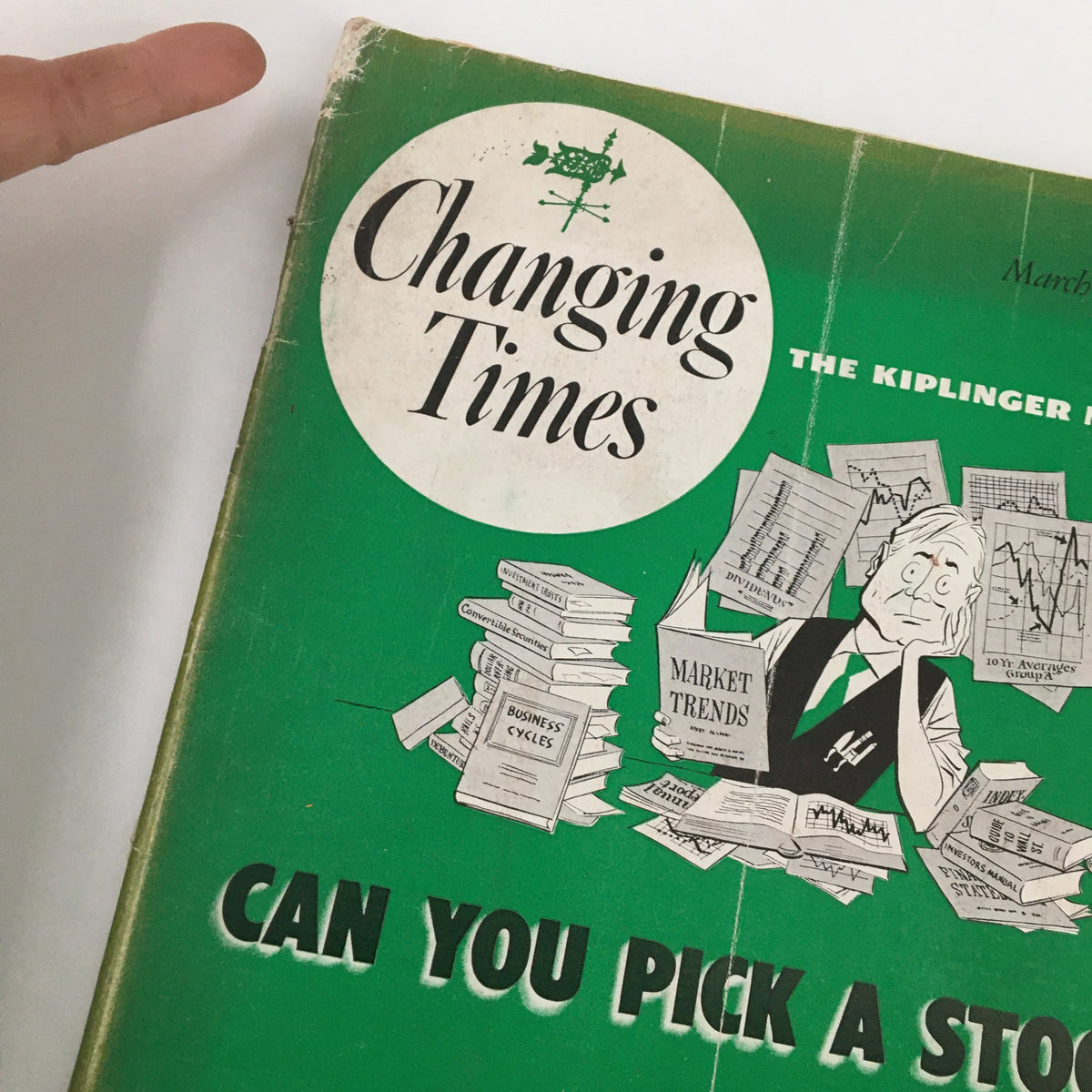 Close-up of the VTG Changing Times Magazine March 1952 cover highlighting the title and illustrations related to job hunting and market trends.