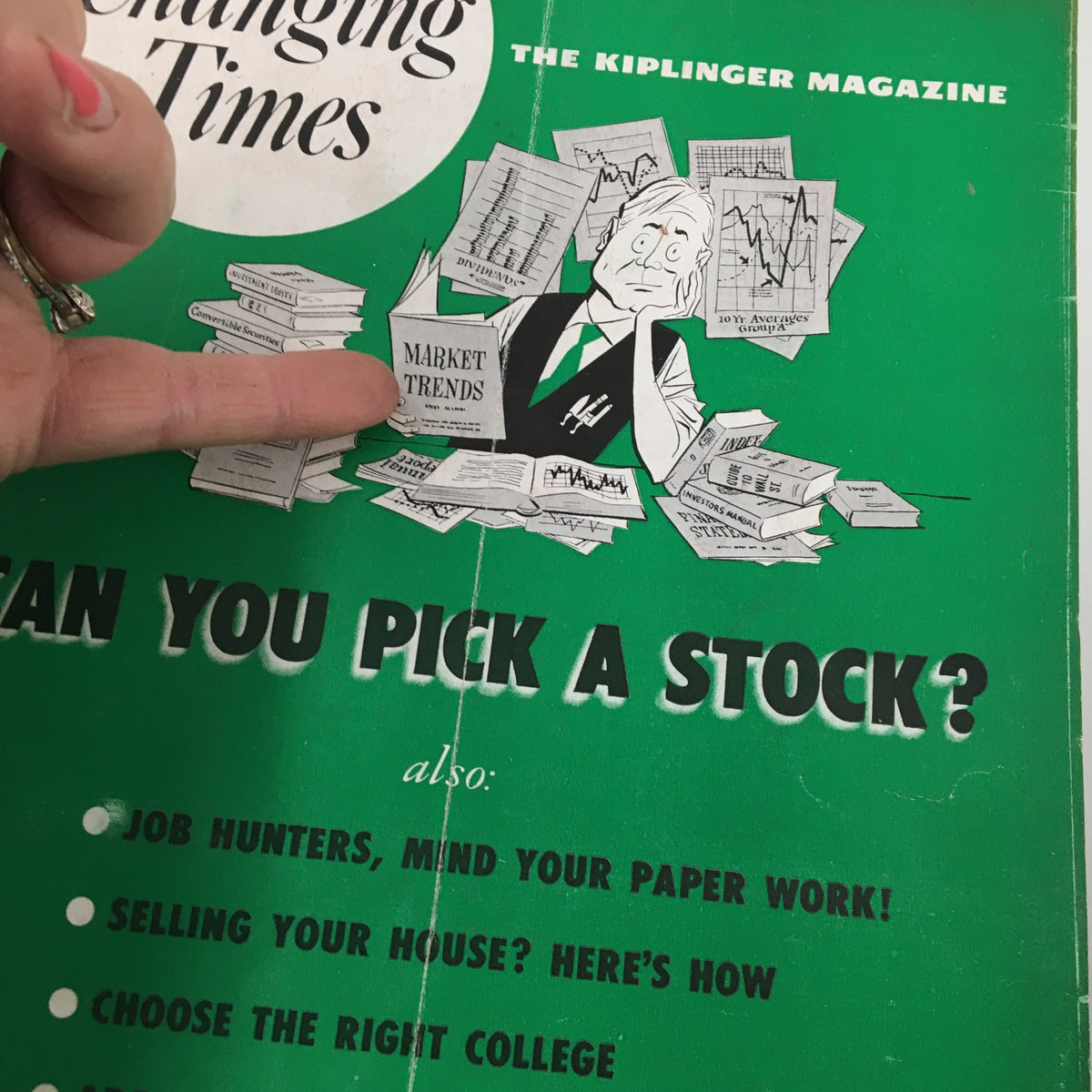 VTG Changing Times Magazine March 1952 cover featuring a man surrounded by financial documents, highlighting the article 'Can You Pick a Stock?' along with job hunting advice.