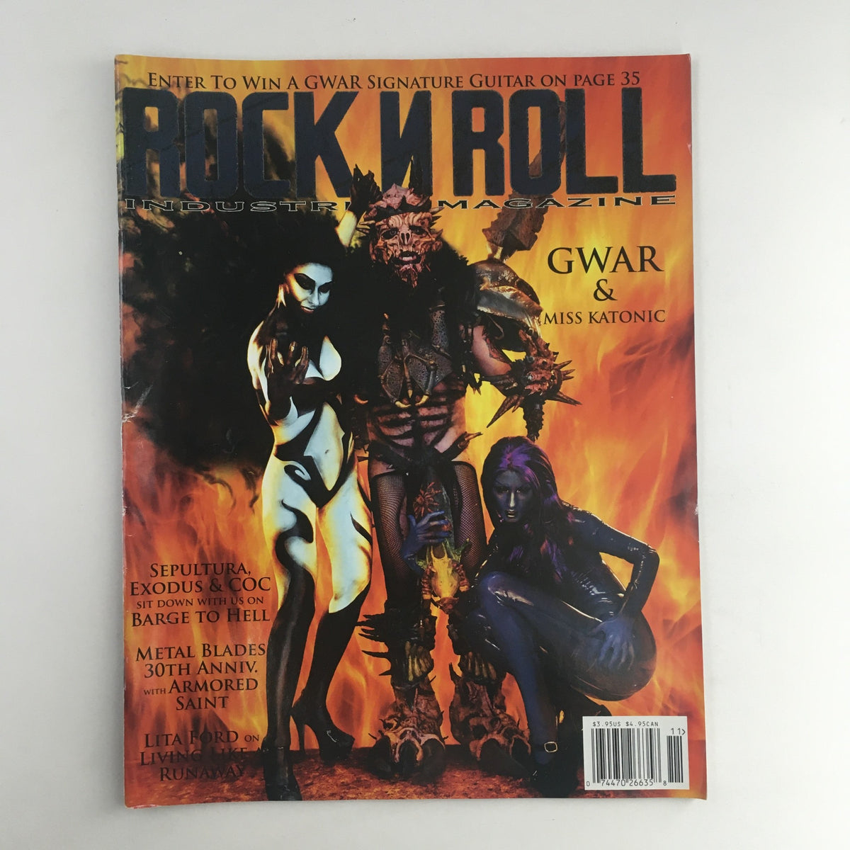 Rock N Roll Industries Magazine featuring GWAR and Miss Katonic on the cover, showcasing vibrant art and headline stories about the legendary band in a vintage 2013 issue.