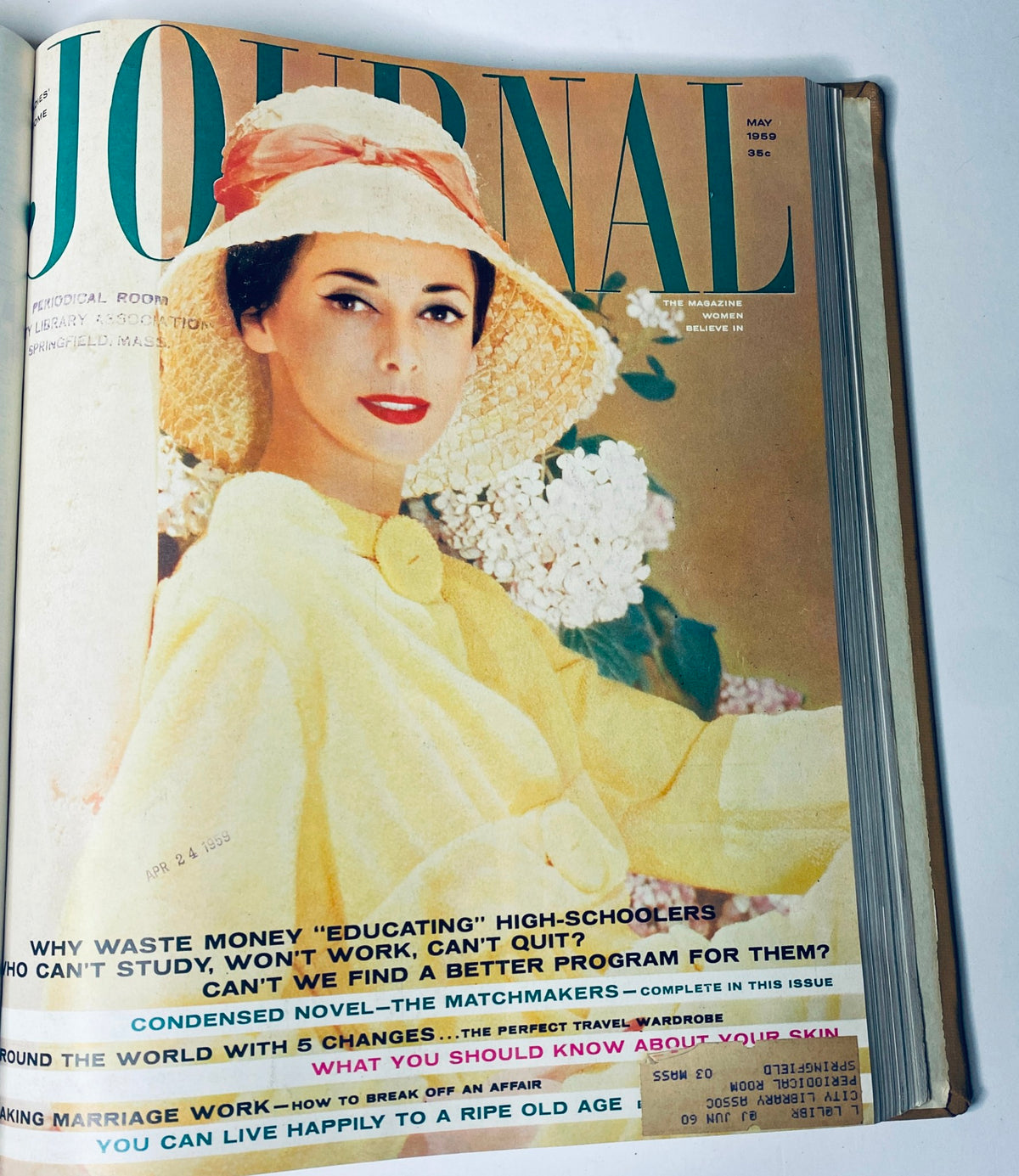 Cover of Ladies' Home Journal, May 1959 issue, depicting a woman in a sun hat with flowers, highlighting mid-century style and topics on education and marriage.