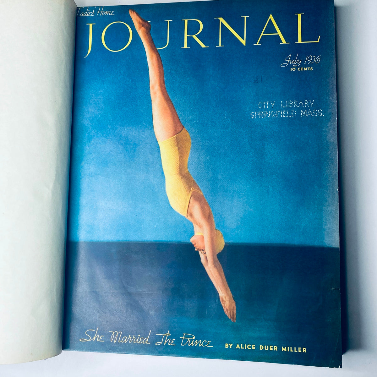 Cover page of the July 1936 Ladies' Home Journal magazine showing a diver in a yellow swimsuit against a blue background, emphasizing mid-20th century American culture.