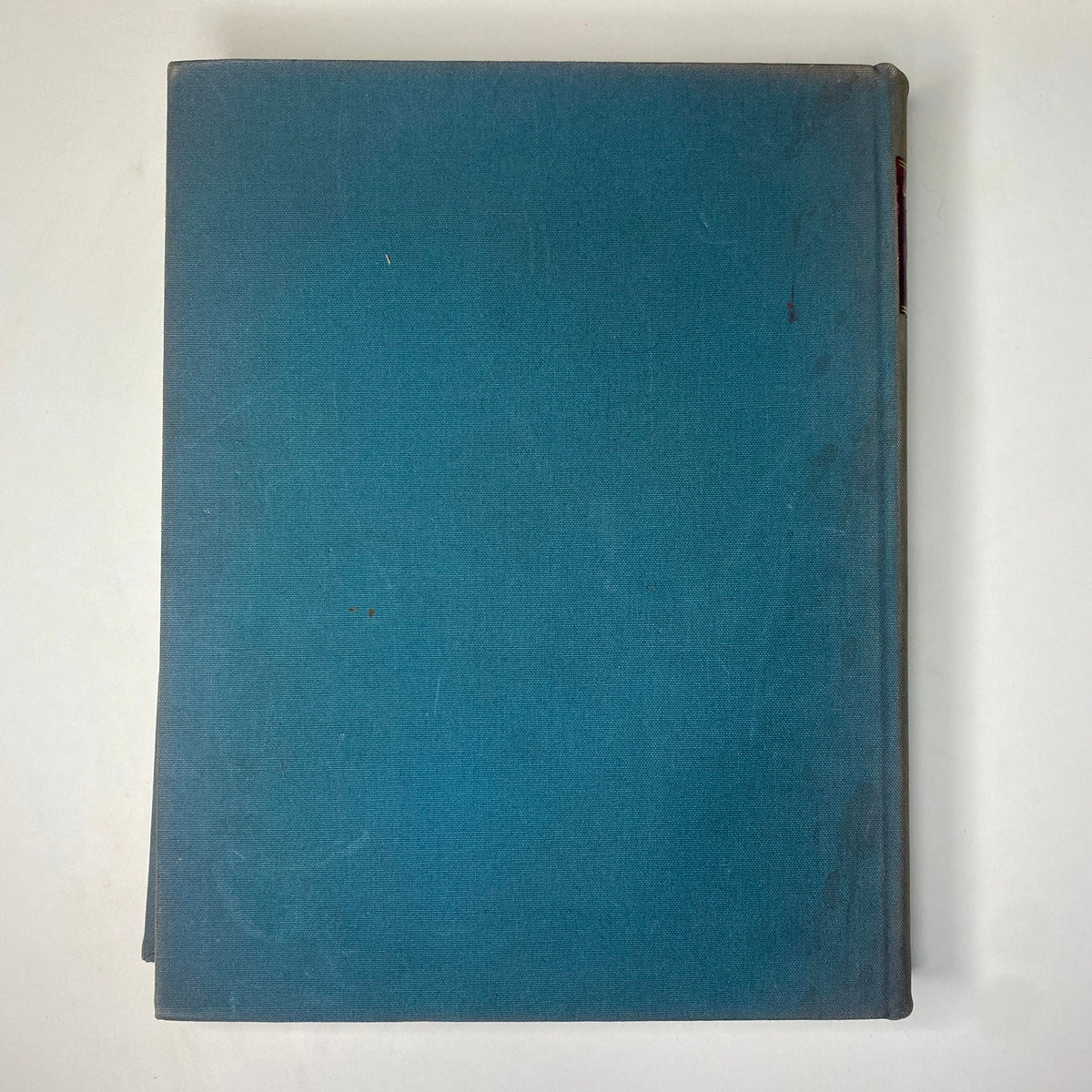 Back cover of the Ladies' Home Journal Bound Magazine 1936, displaying a plain blue hardcover without any visible details, signifying the bound volume's overall condition in a vintage style.