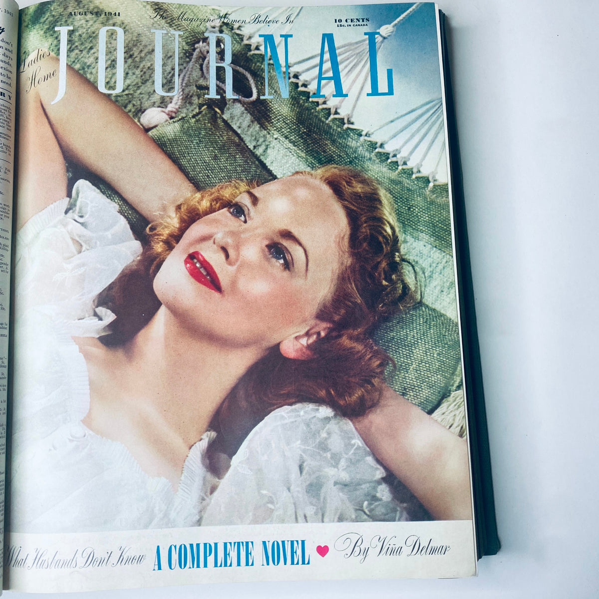 Cover of Ladies' Home Journal August 1941, featuring a glamorous woman with red lips lounging. This is part of the 1941 complete magazine collection.