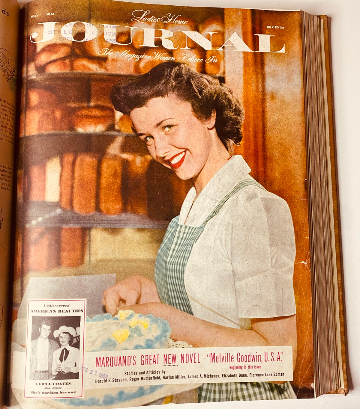 Cover of Ladies' Home Journal May 1951 magazine showcasing a woman in a kitchen with a bright smile, surrounded by freshly baked goods. This cover reflects the home-centric theme of the publication.