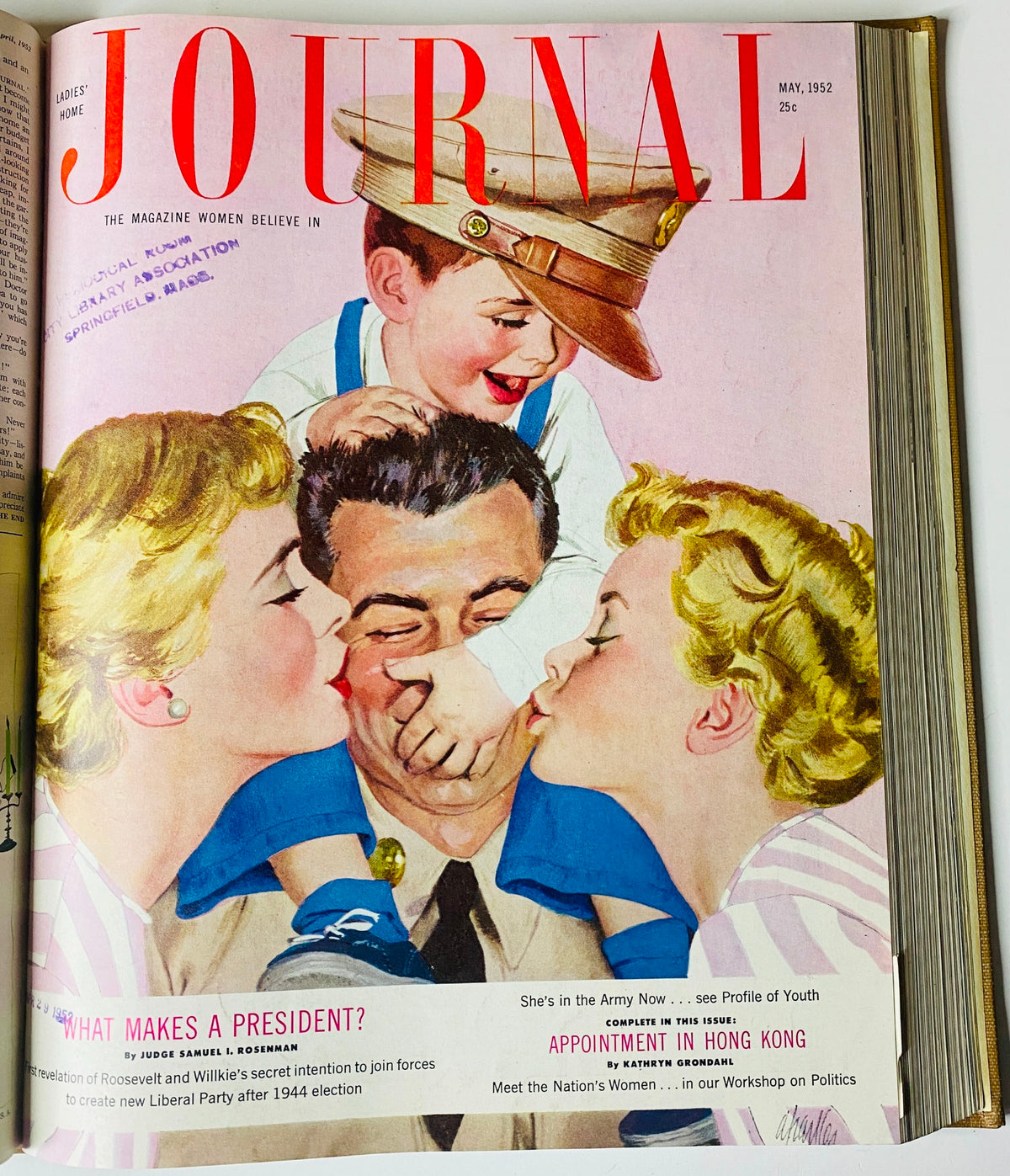 Cover of Ladies' Home Journal, May 1952, featuring a colorful illustration of a family interacting joyfully, with the title prominently displayed.