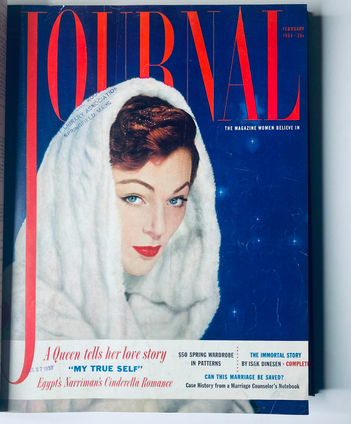 February 1953 cover of Ladies' Home Journal, depicting a woman in a white fur wrap with a captivating gaze. The cover includes headlines about love stories and wardrobe tips. This image is part of the Ladies' Home Journal Library Bound Magazine 1953 Full Year January - December.