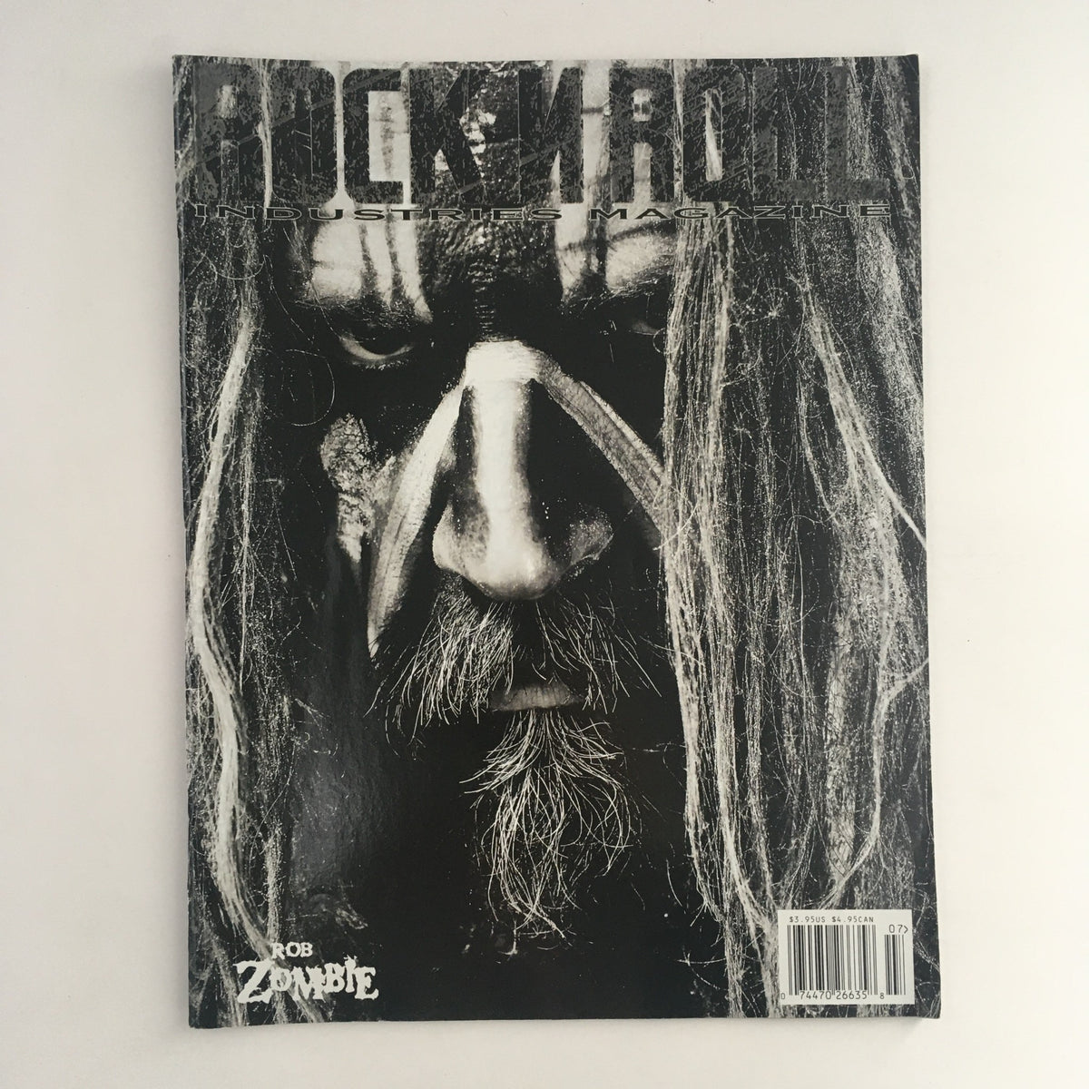 Cover of Rock N Roll Industries Magazine 2013 Issue 8 featuring Rob Zombie, showcasing a striking black and white portrait that emphasizes his intense features and iconic style.