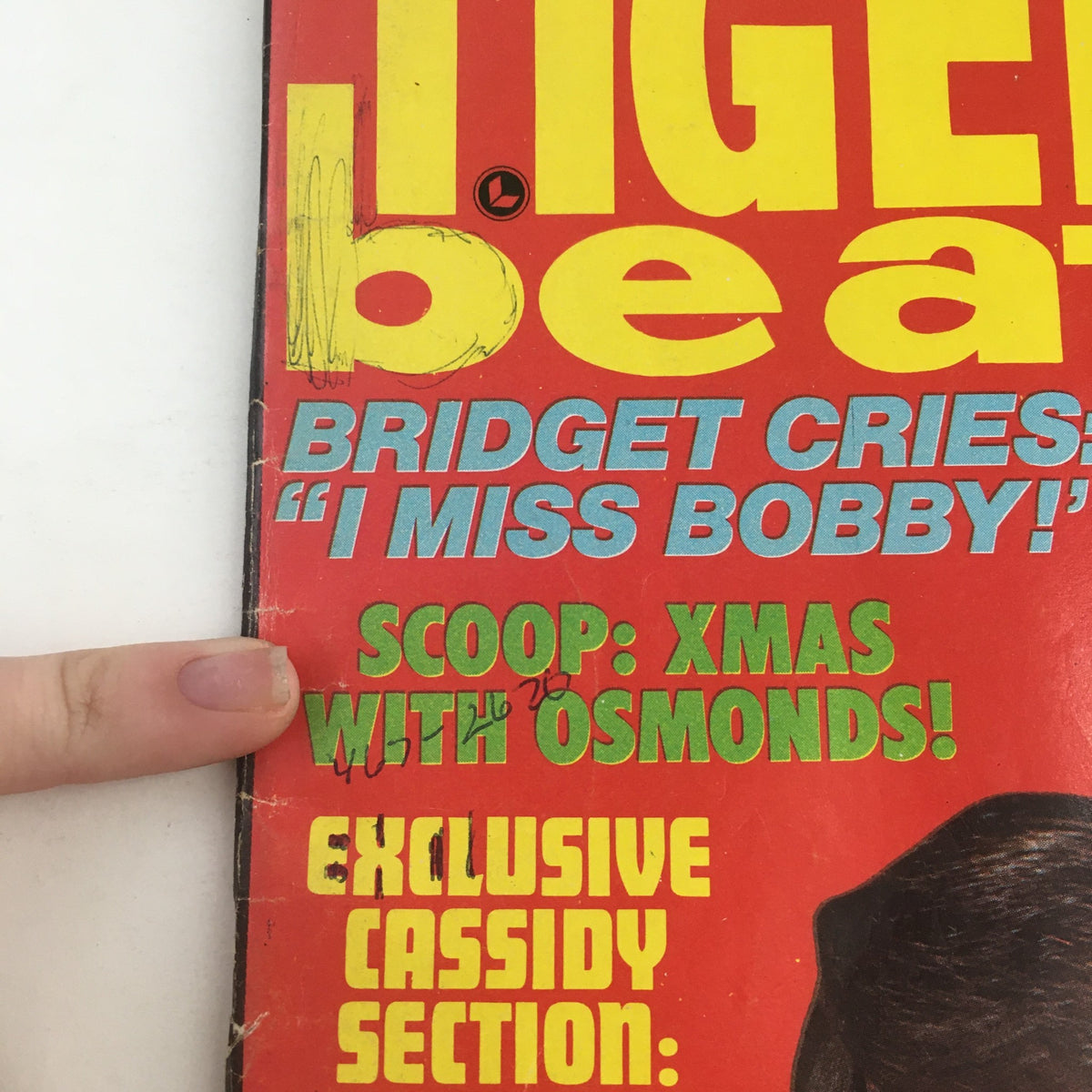 Close-up detail from the cover of Tiger Beat Magazine January 1971, highlighting 'Scoop: Xmas with Osmonds!' reflecting the magazine's focus on popular teen culture.
