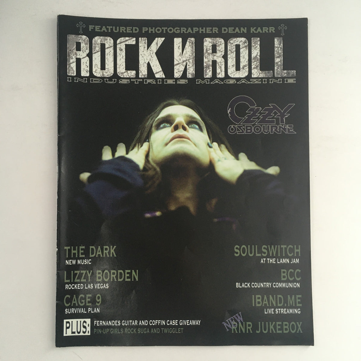 Cover of Rock N Roll Industries Magazine 2011 featuring Ozzy Osbourne and Lizzy Borden, showcasing an iconic representation of heavy metal culture.