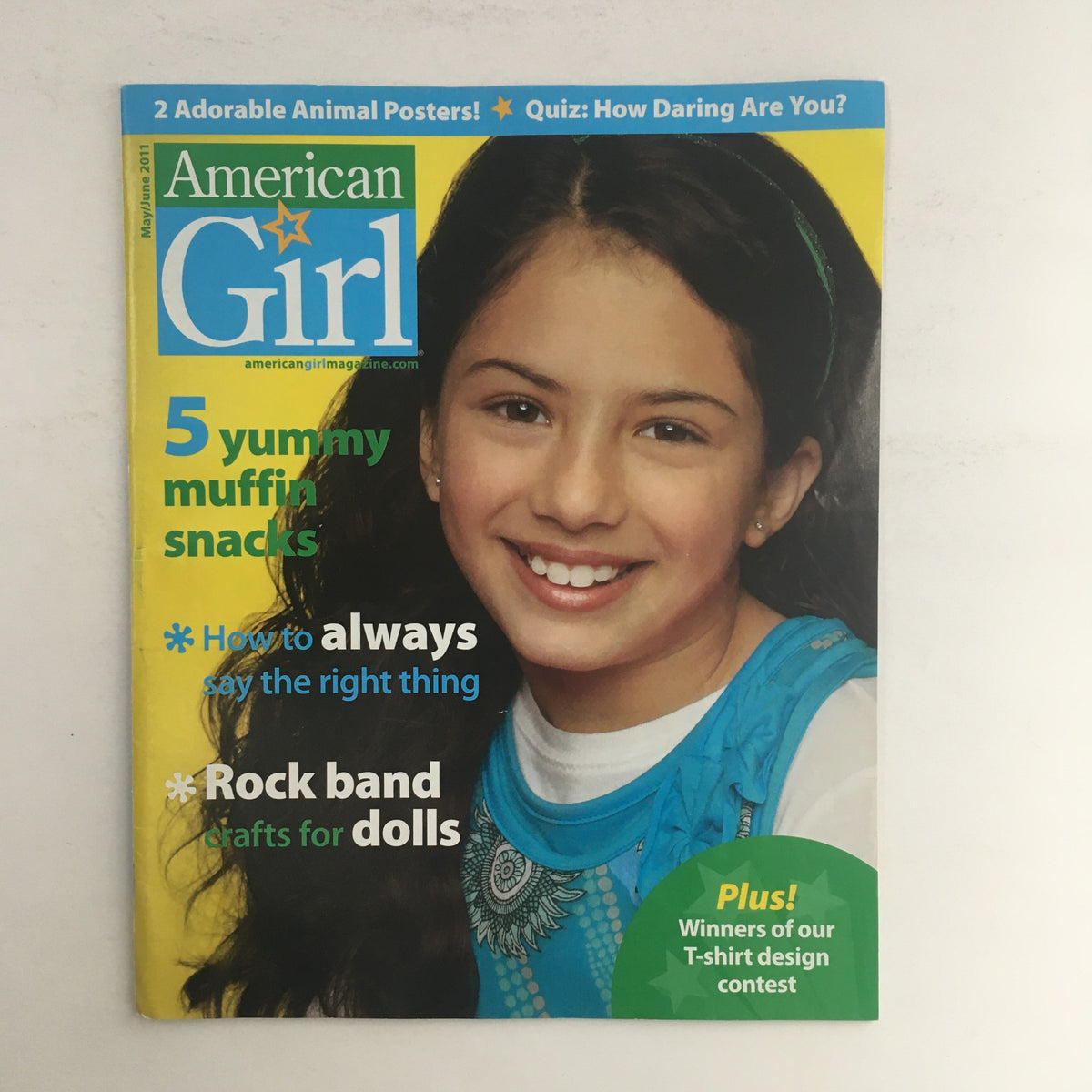 Cover of American Girl Magazine May 2011 featuring an article on 'How To Always Say The Right Thing' and a feature on muffin snacks. The cover includes a smiling girl and colorful graphics, attracting young readers.