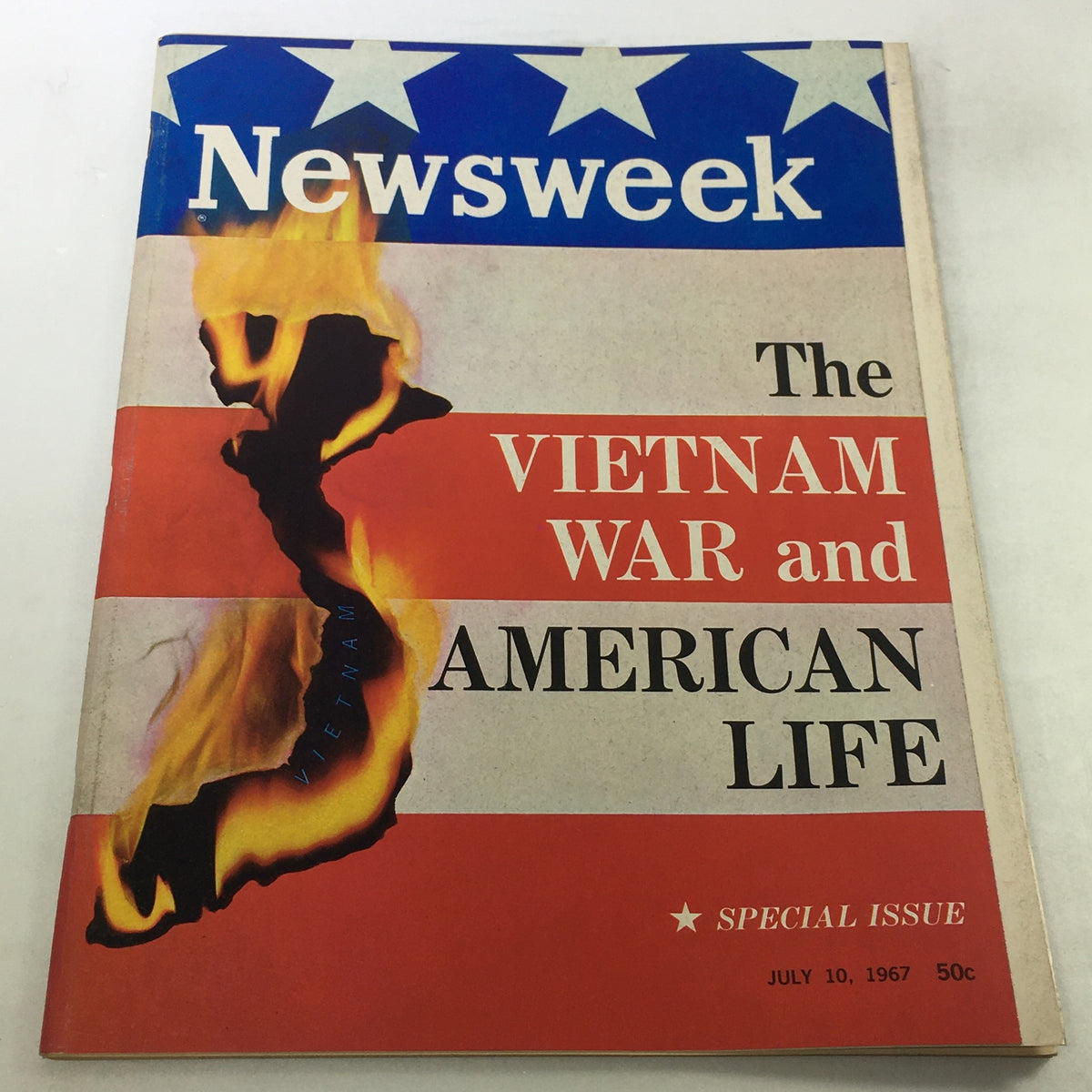 Cover of the VTG Newsweek Magazine July 10 1967 featuring 'The Vietnam War & American Life'. The cover displays a map of Vietnam engulfed in flames with patriotic colors and text, emphasizing the historic significance of this special issue.