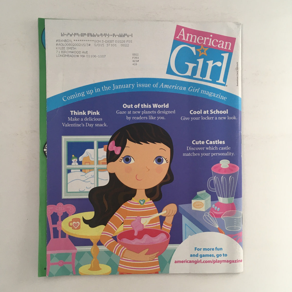 Cover of American Girl Magazine November 2014 featuring a young girl preparing a recipe, with text about upcoming issue highlights and colorful visuals.