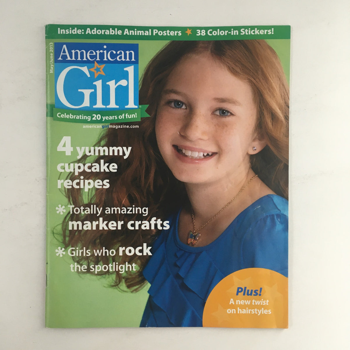 Cover of American Girl Magazine May 2013 featuring the title and a smiling girl. Includes a feature on 4 yummy cupcake recipes, marker crafts, and girls who rock the spotlight.