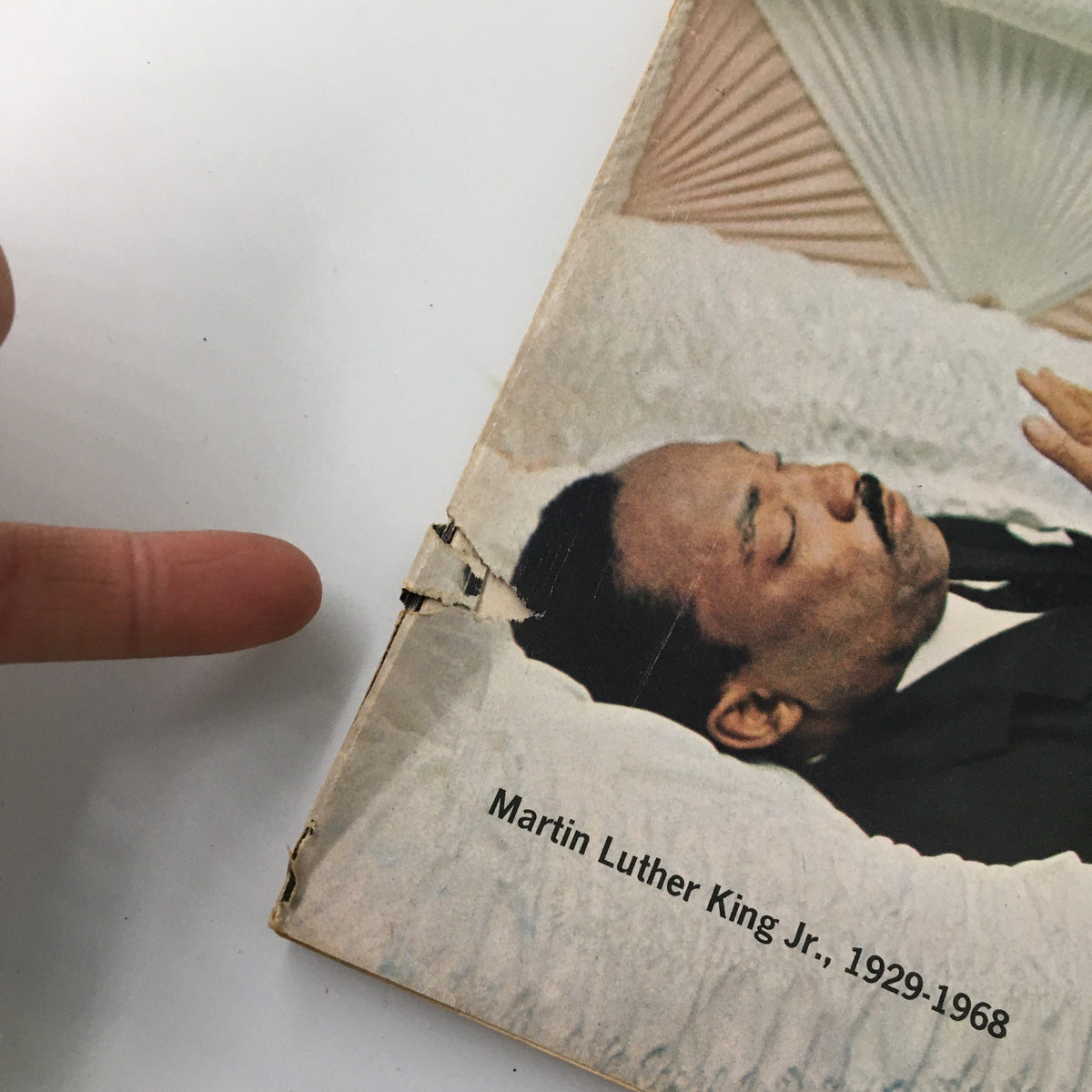 Detail of the VTG Newsweek Magazine showing Martin Luther King Jr.'s name, with a focus on the magazine's wear and tear.