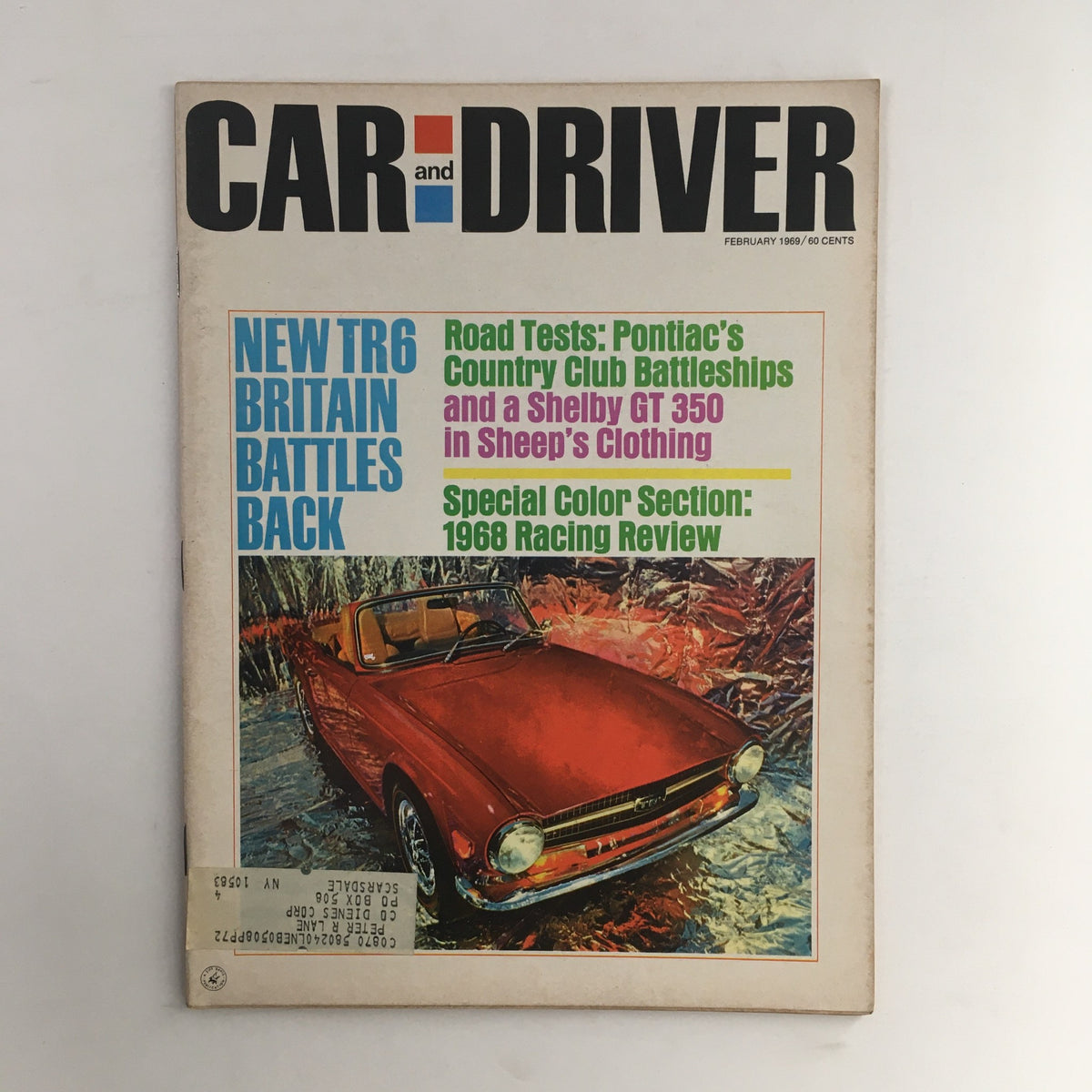 Cover of Car and Driver Magazine, February 1969 edition featuring Pontiac's Country Club Battleships, along with a road test of a Shelby GT 350. The cover includes vibrant text highlighting automotive features and a colorful illustration of a vehicle, embodying the classic automotive culture of the 1960s.