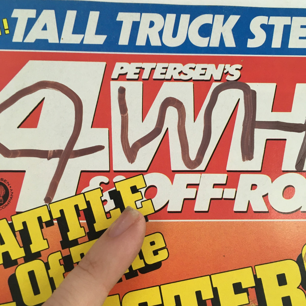 Cover of Petersen's 4 Wheel & Off-Road Magazine February 1986 featuring 'Battle of the Monsters'. The magazine highlights off-road vehicles with prominent text and a finger pointing at the title.