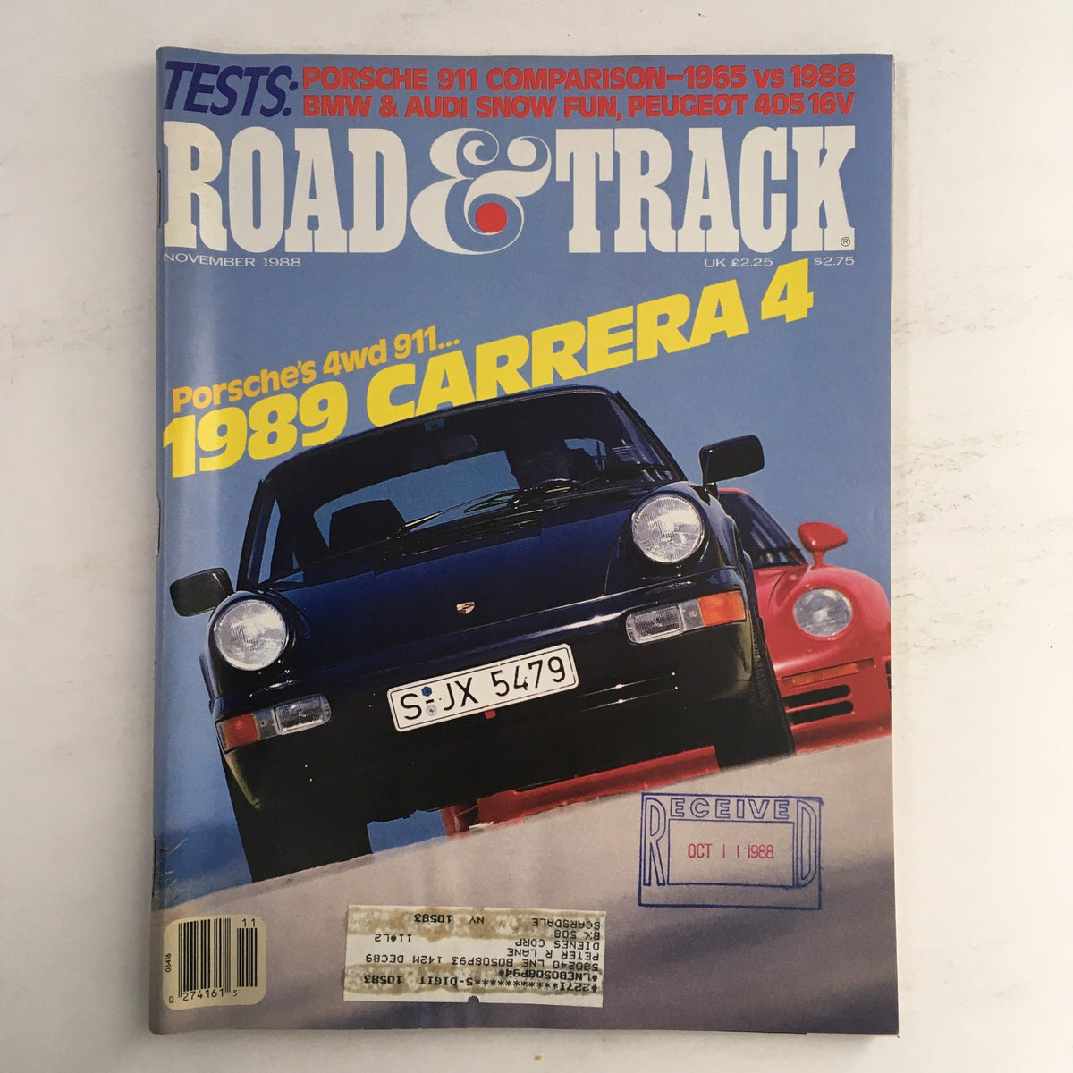 Cover of Road & Track Magazine November 1988 featuring Porsche's 4 Wheel-Drive 911 and the 1989 Carrera 4. This vintage issue highlights performance automobiles.