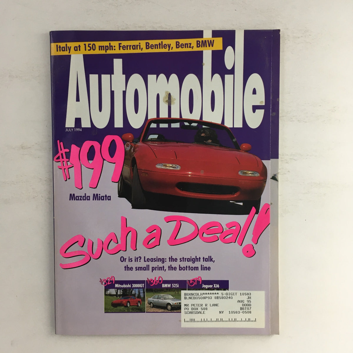 Cover of Automobile Magazine, July 1994 featuring the Mazda Miata with the headline 'Such a Deal!' and images of cars including Mitsubishi 3000GT, BMW 525i, and Jaguar XJ6.