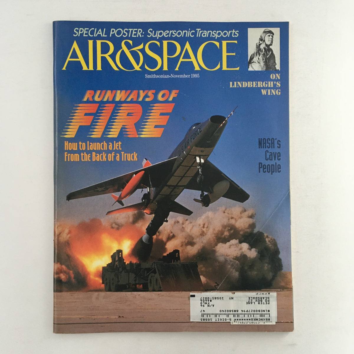 Cover of Air & Space Smithsonian Magazine November 1995 featuring the article 'Runways of Fire: How to launch a Jet from the Back of a Truck' with a dramatic image of a jet taking off amidst a cloud of smoke.