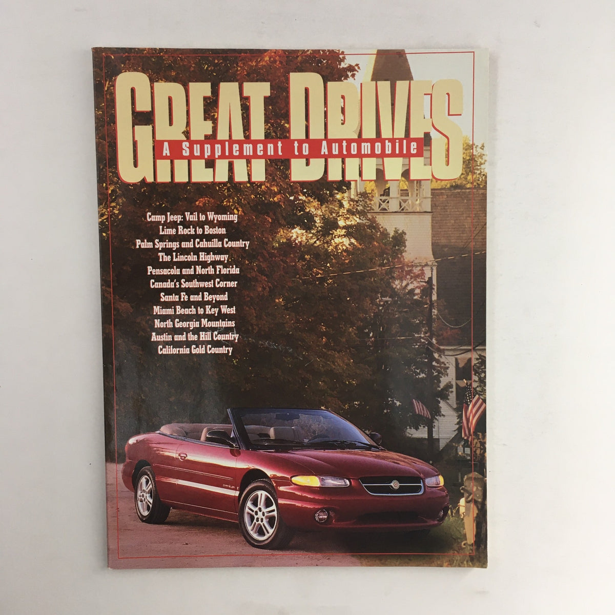 Cover of Great Drives Magazine featuring the Camp Jeep Vail to Wyoming Line To Boston edition, showcasing a scenic backdrop and a convertible car.