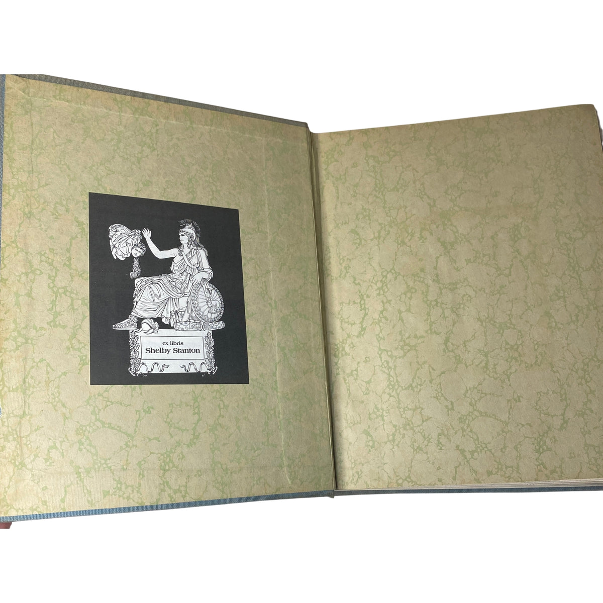 Inside view of Ladies' Home Journal Library Bound Magazine 1942 - Full Year January to December, showcasing the decorative endpaper with an ex libris label.