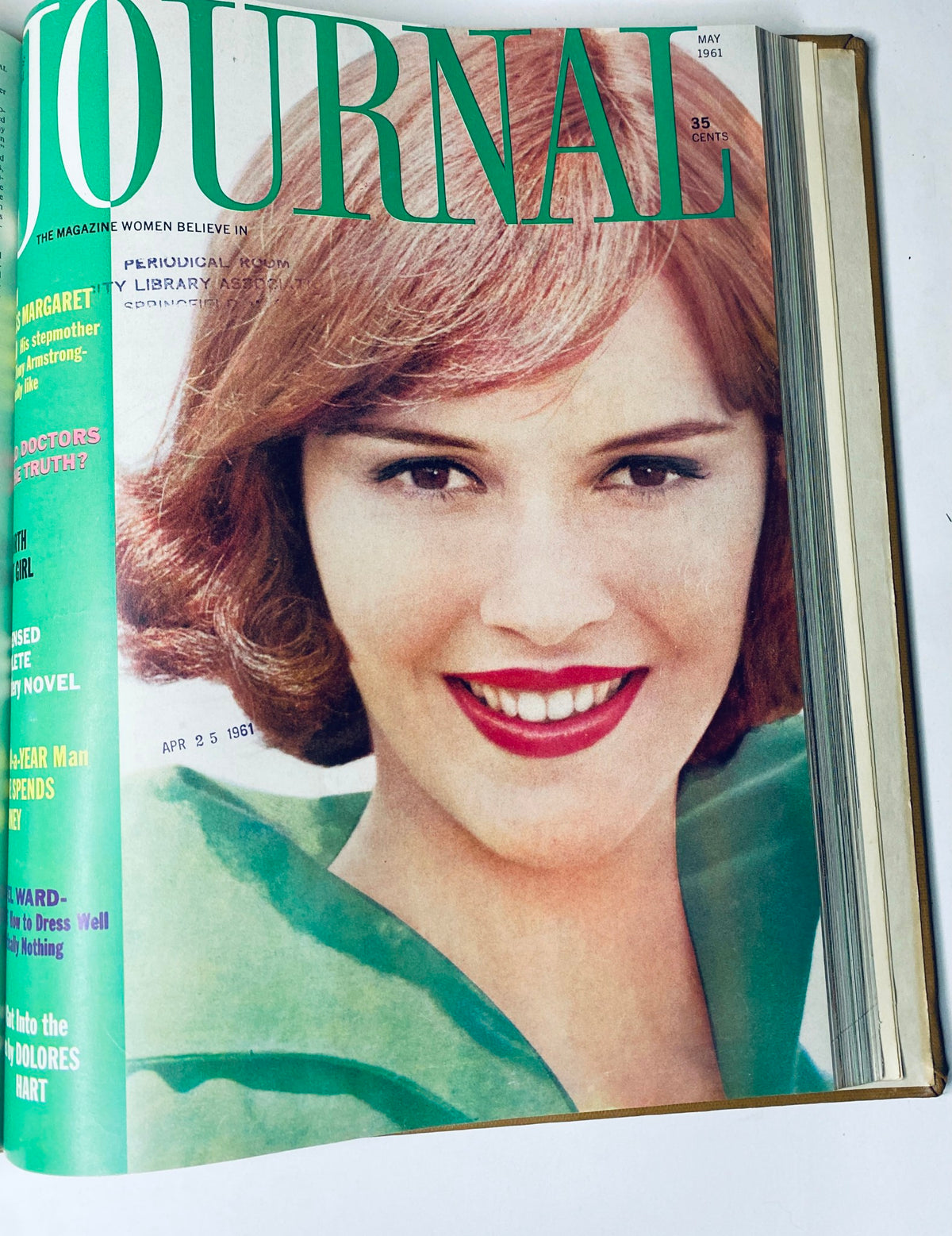 Cover of Ladies' Home Journal Bound Magazine 1961, a bright May edition featuring a smiling woman in green attire, discussing themes of beauty and lifestyle.