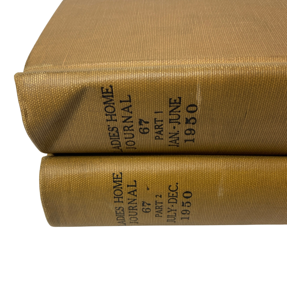 Close-up of Ladies' Home Journal Library Bound Magazine 1950, showing the gold binding and spine detailing of the two volumes.