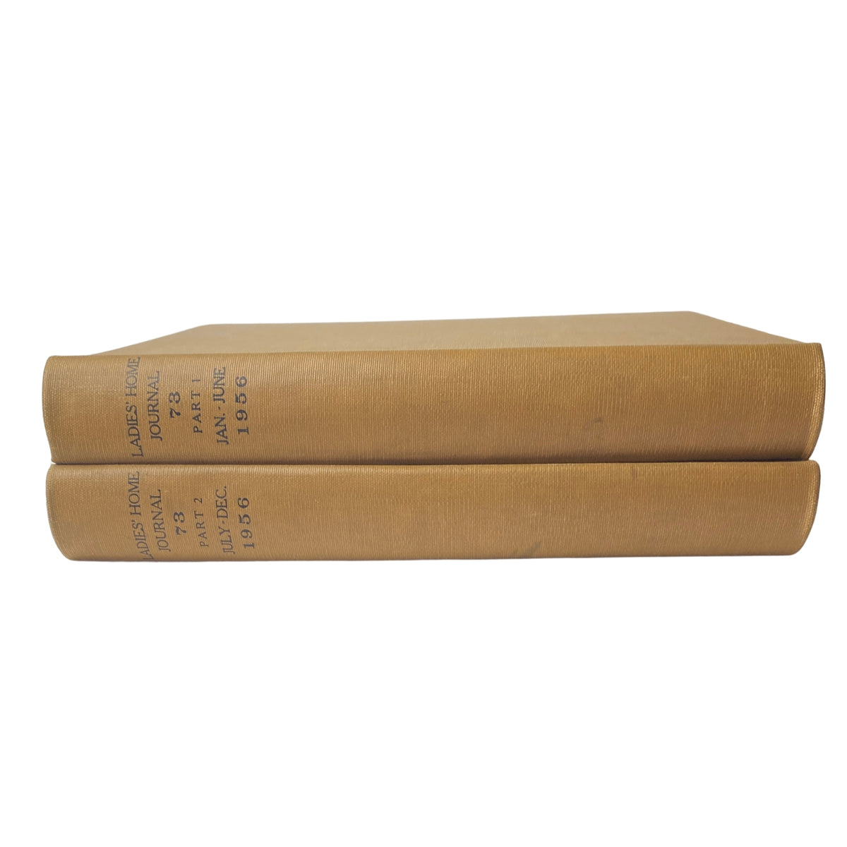 Ladies' Home Journal Library Bound Magazine 1956 Full Year January - December, displaying two bound volumes with a textured yellow cover, showcasing 'Ladies Home Journal' text and publication dates.