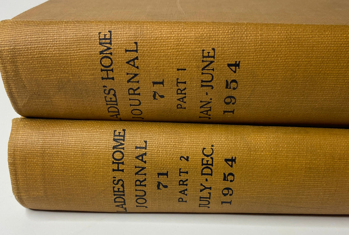 Close-up view of the spines of Ladies' Home Journal Bound Magazine 1954, highlighting the titles and publication periods.