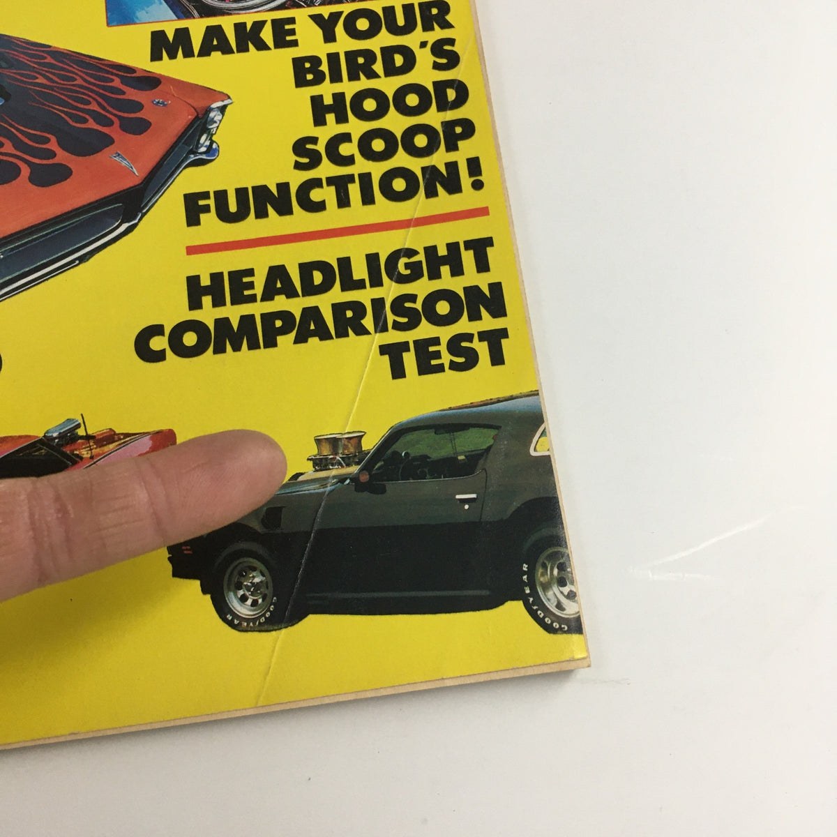 Detail from the cover of Cars Magazine Performance Pontiac Power, Firebirds & GTO's Test highlighting features such as 'Make Your Bird's Hood Scoop Function' and a Pontiac Firebird car.