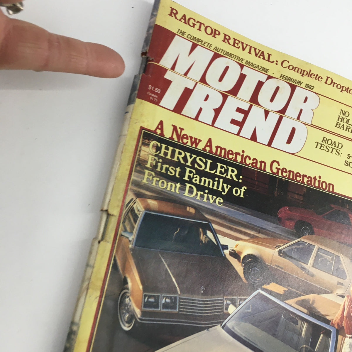 Close-up of Motor Trend Magazine February 1982 cover highlighting Chrysler: First Family of Front Drive and nostalgic automotive designs.