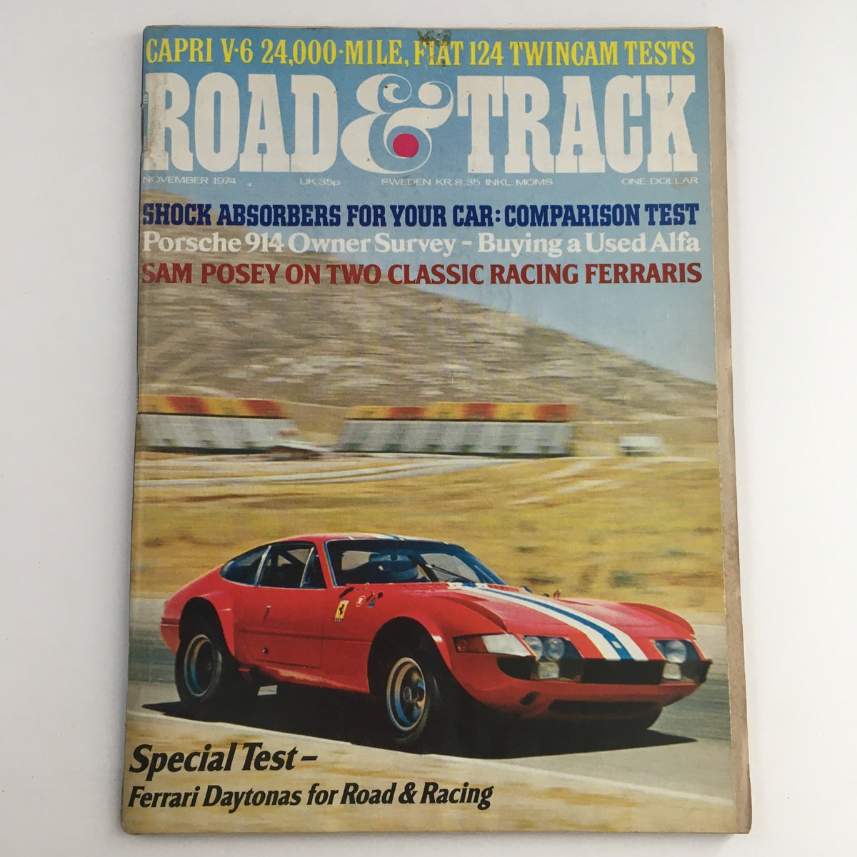 Road & Track Magazine November 1974 cover featuring Ferrari Daytonas for Road & Racing, showcasing a classic Ferrari car in action.