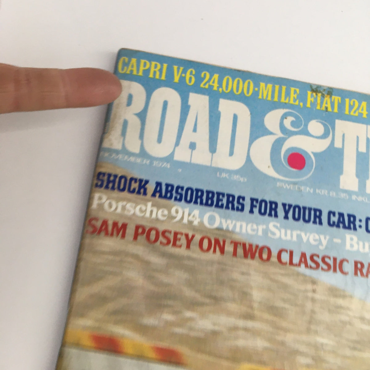 Close-up view of the Road & Track Magazine November 1974 cover highlighting features on Ferrari Daytonas, Porsche 914, and automotive tests.